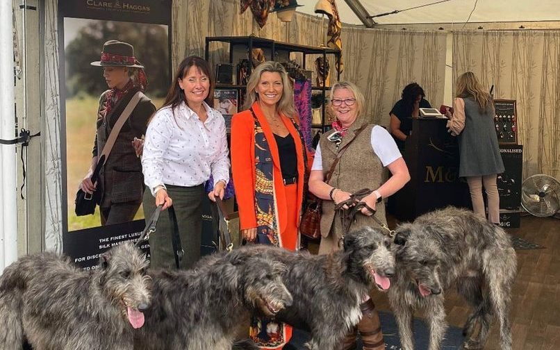Clare Haggas with attendees and their dogs 