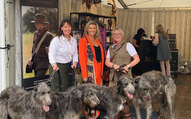 Clare Haggas with attendees and their dogs